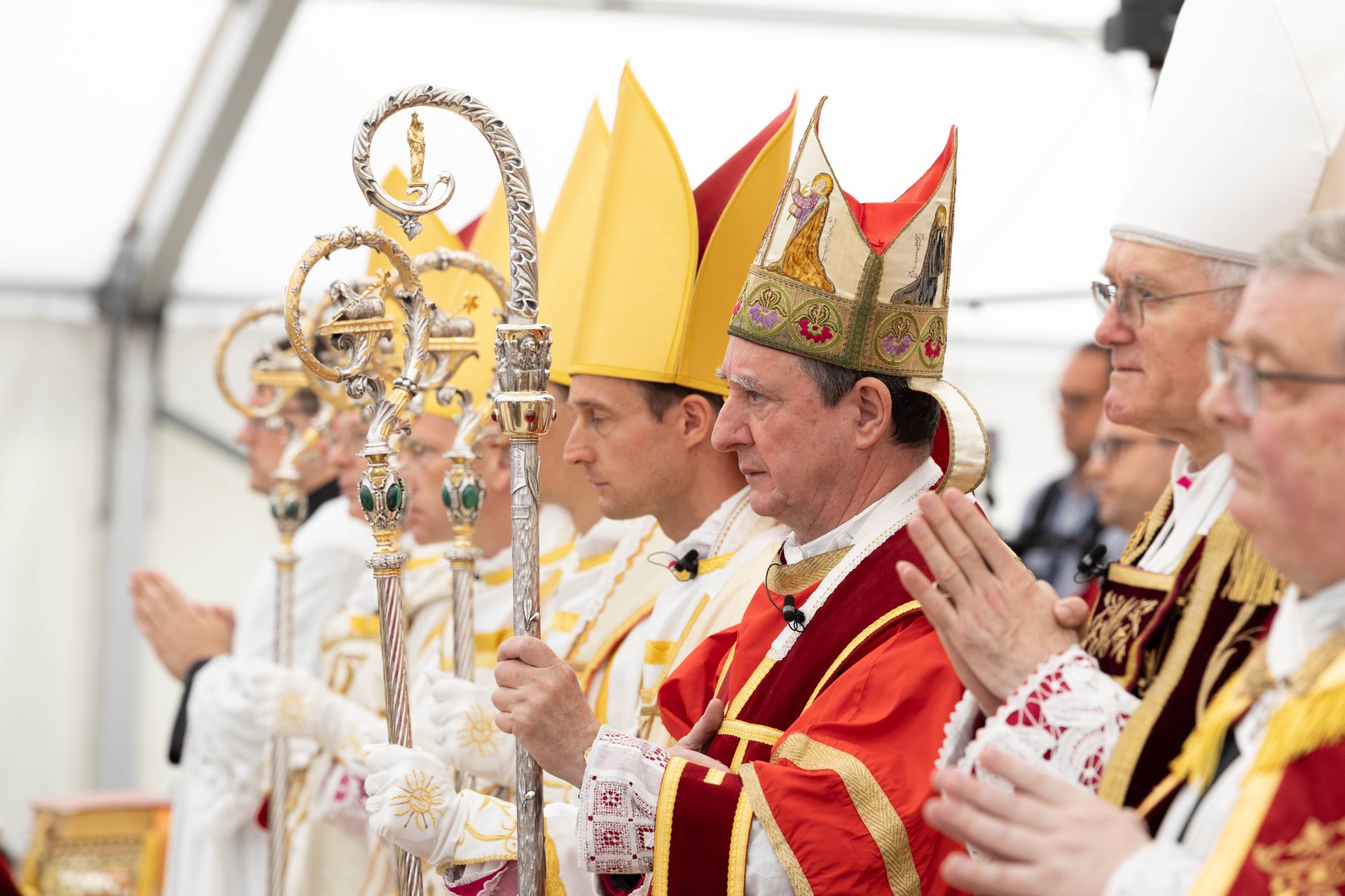 Bishops hold their crosiers during the …